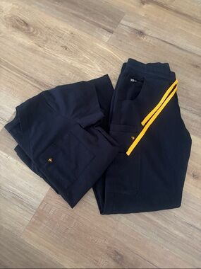 Women’s Poppy Black Scrub Pants with Orange Accent and matching small top